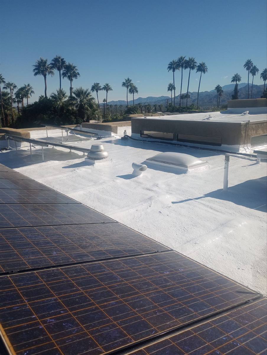 Finished cool roof with solar panels overlooking the Coachella Valley
