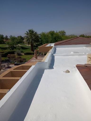 White parapet roof finished overlooking a Coachella Valley golf course