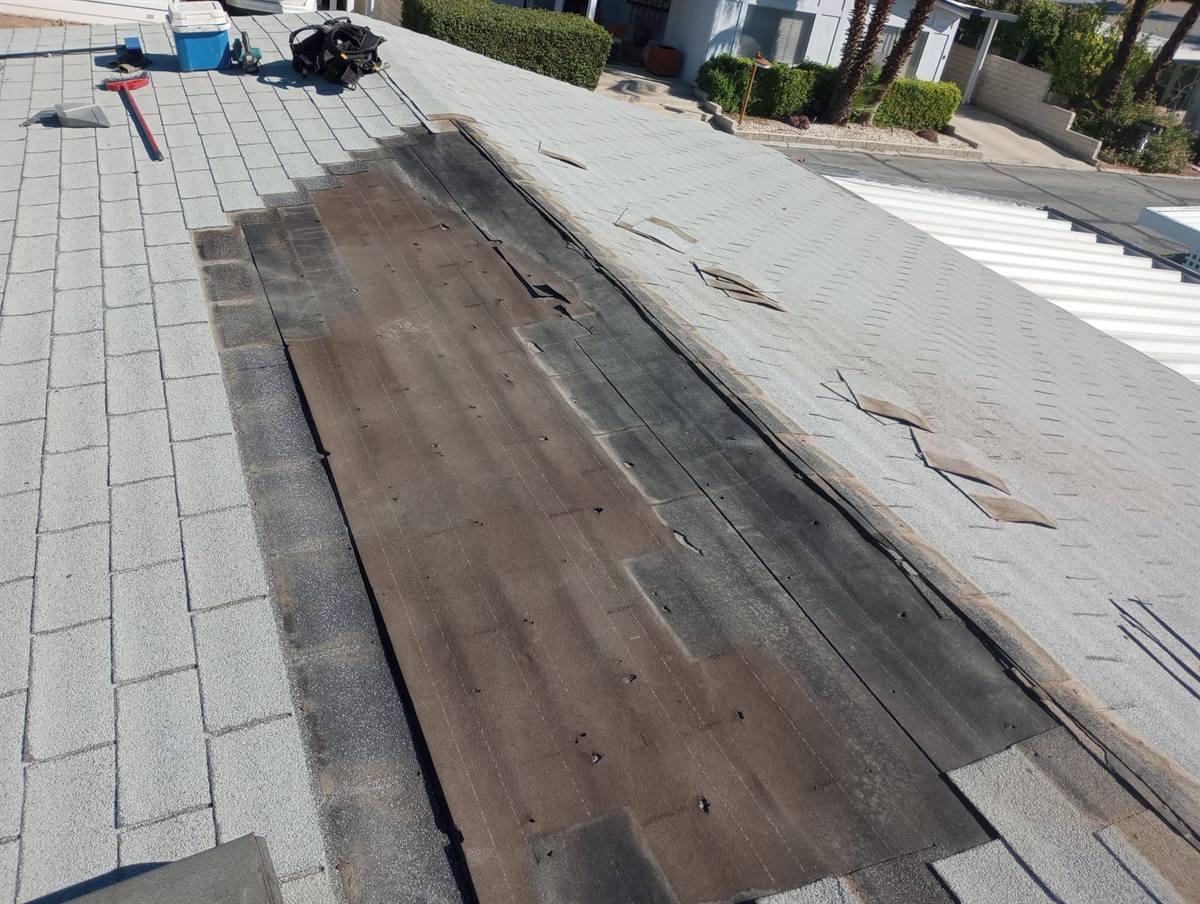 Asphalt shingle valley repair with new underlayment going down