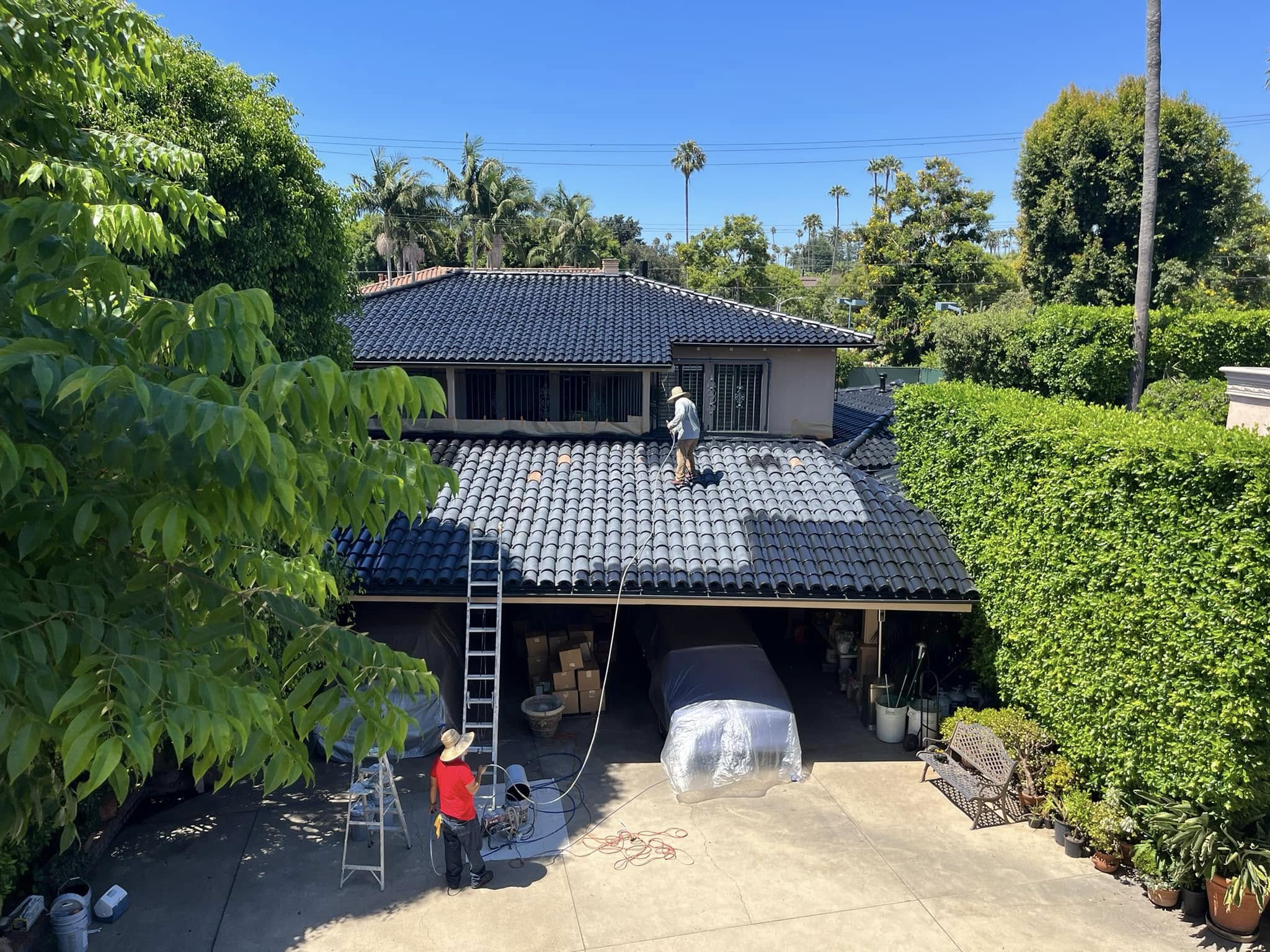 Tile roof painting on a Coachella Valley home